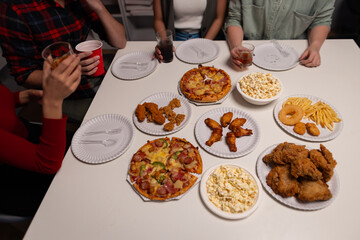 Friends threw a party to celebrate, drinking drinks, eating food, and chatting happily. Friends' birthday parties. Long weekend party with colleague at workplace.