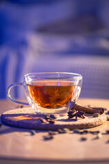 Fragrant black tea with spices on the table, close-up.