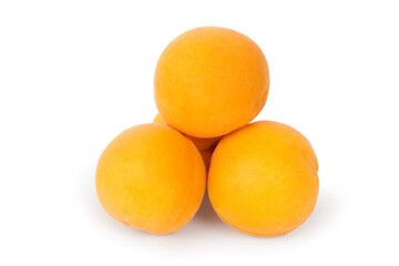 A pile of natural apricots on a white background.