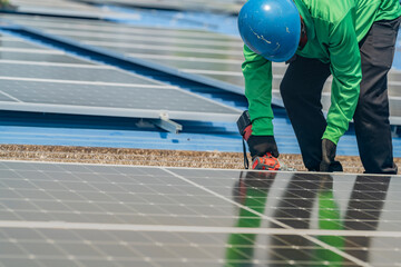 Worker Technicians are working to construct solar panels system on roof. Installing solar photovoltaic panel system. Men technicians walking on roof structure to check photovoltaic solar modules.