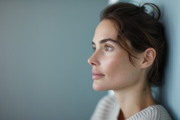 Contemplative Woman Gazing at Wall - Mental Health and Depression Concept