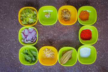 spices used for cooking. Onion, ginger, garlic, turmeric powder, slat, chilly powder, herbs, etc.