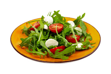 Simple salad of arugula tomatoes and cheese on an orange plate isolated on white