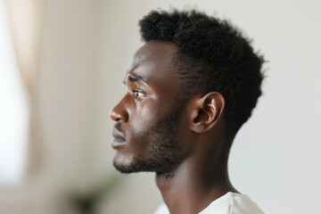 Obraz premium Contemplative Man in Profile Showing Signs of Mental Health Struggles and Self-Doubt