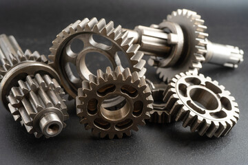 Gear and cogs wheels, clock mechanism, brass metal engine industrial.