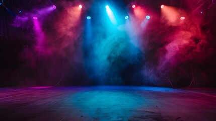 Fototapeta premium An empty stage is dramatically lit with vibrant blue and purple spotlights, casting a hazy glow and creating an anticipation for the upcoming performance