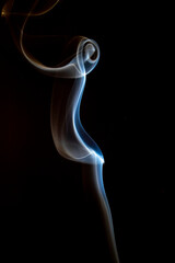 The artwork created from smoke is beautiful and gentle. Taken with a camera that has a high magnification rate.