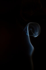 The artwork created from smoke is beautiful and gentle. Taken with a camera that has a high magnification rate.