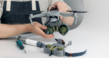 Modern army aerial drone for artillery guidance and scouting view enemy positions in military operation. Engineer work for design of bomb release device for military UAVs robot