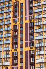 Colorful facade of modern apartment building featuring geometric design.