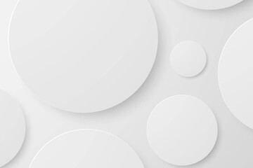 Abstract white circles with soft shadows on a light grey background.