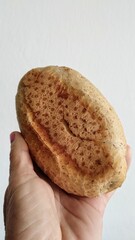 hand holding a bread