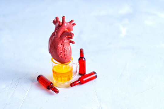 Heart Model with Alcohol Bottles on Gray