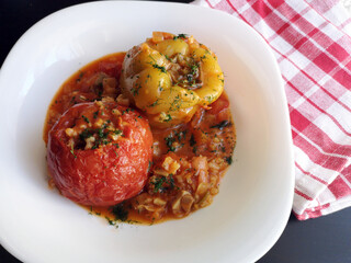 Stuffed pepper and tomato