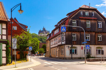Medieval street, half-timbered houses and castle in Wernigerode, Saxony-Anhalt, Germany © Kavalenkava