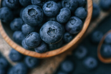 Blueberries background. Blueberry border design. Ripe and juicy fresh picked bilberries close up. Copyspace for your text