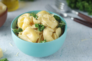 A bowl with Italian dumplings - tortellini