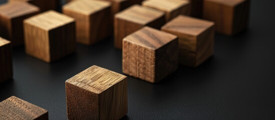 Wooden cubes depicting concepts of policies and procedures on a sleek black background illustrating a business theme with copy space image