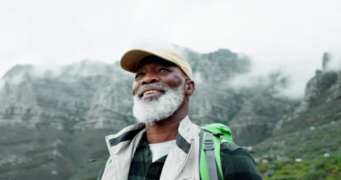 Senior man, smile and hiking in mountains with backpack, adventure and view in nature. Outdoor, camping and travel with relax vacation and happy African person in winter with journey and camp bag