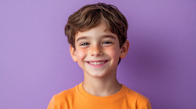 Cheerful boy against a soft lilac background