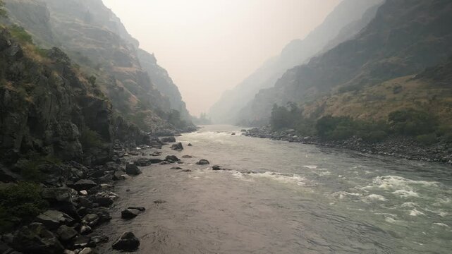 Aerial above snake river in hells canyon in smoke.mov