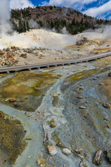 dramatic volcanic landscape of hot steams and sulfur laden pools, hydrothermal area  in Bumpass Hell in Lassen National Park.