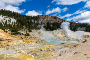 dramatic volcanic landscape of hot steams and sulfur laden pools, hydrothermal area  in Bumpass Hell in Lassen National Park.