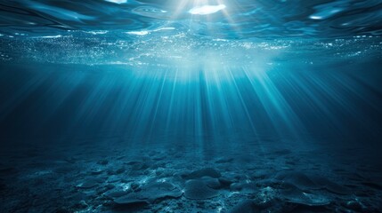 Obraz premium Underwater Sunlight Beams through Ocean.