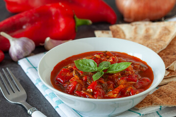 Traditional balkanic and mediterranean food  made with red bell pepper, tomato and onion.  Served with bread.
