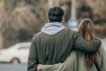 urban young romantic couple on the street hugging