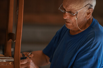 upholsterer craftsman working in the workshop