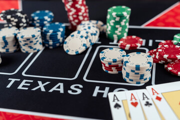  composition of poker chips and playing card on casino table