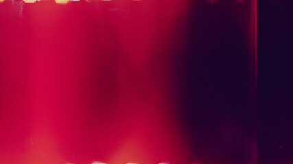 Film effect overlay. Real scan film strip texture with burn light leaks, noise, dust and scratches. Abstract background.