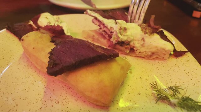 A short clip of someone eating Pastrami in an Italian Restaurant in S&atilde;o Paulo, Brazil. 