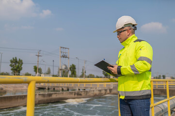 Environmental engineers work at wastewater treatment plants,Water supply engineering working at Water recycling plant for reuse