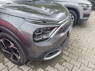Fototapeta premium close up new grey car near showroom for rent or sale