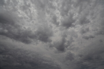 Gray clouds in the sky closed the sunlight, black and white shot of gray sky