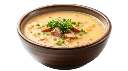 Creamy split pea soup garnished with ham, carrots, peas, and fresh parsley in a wooden bowl