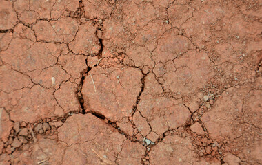 a close up of the red ground with a cracked surface