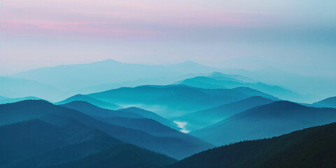 Obraz premium Serene Sunrise Over Misty Blue Mountains in a Tranquil Landscape