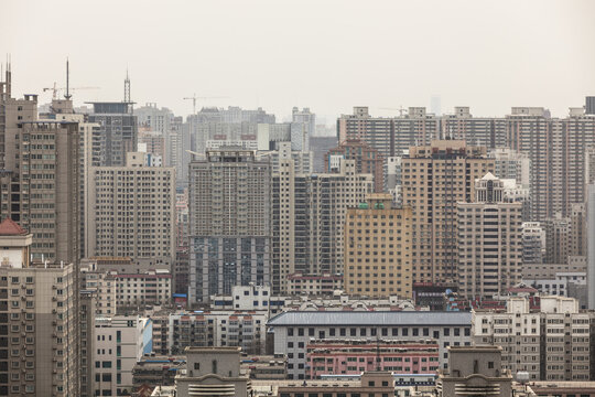 Dense Shanghai cityscape with numerous tall buildings