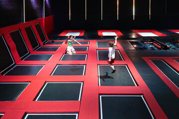 Friends enjoying an energetic day at a trampoline park