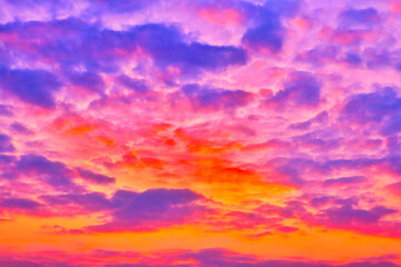 The evening sunset, light shines through the clouds as waves, sparkling, beautiful, natural, in a unique style. Northern Thailand, Southeast Asia