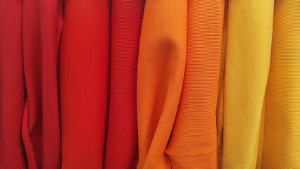Obraz premium Sample of dress textile various colors catalog and swatch of fabric. Collection of multicolored cloth.