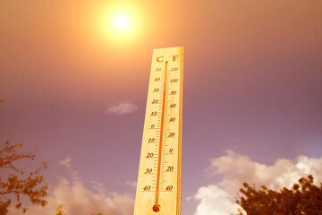 Thermometer shows high temperature in summer heat