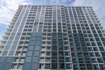 Fototapeta premium New hotel assignment with monotonous balconies and windows.
