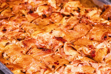 lasagna on metal tray, self-service restaurant food in Brazil