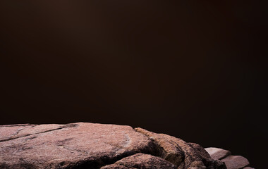 Background Product display with Stone Rock podium isolated on brown wall concrete,Studio Background with Sea Rock cliff with rough surface texture with light and shadow,Concept for Autumn Banner
