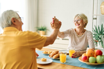 breakfast woman man senior couple home retirement wife husband elderly together happy morning old...