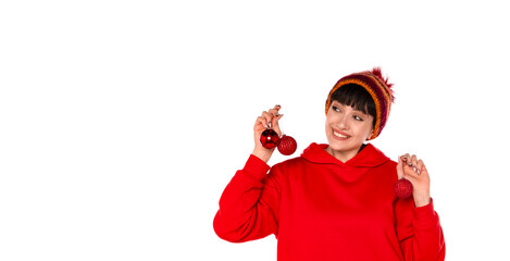 Cheerful Person in Red Sweater Holding Christmas Ornaments With Bright Smile in Festive Atmosphere